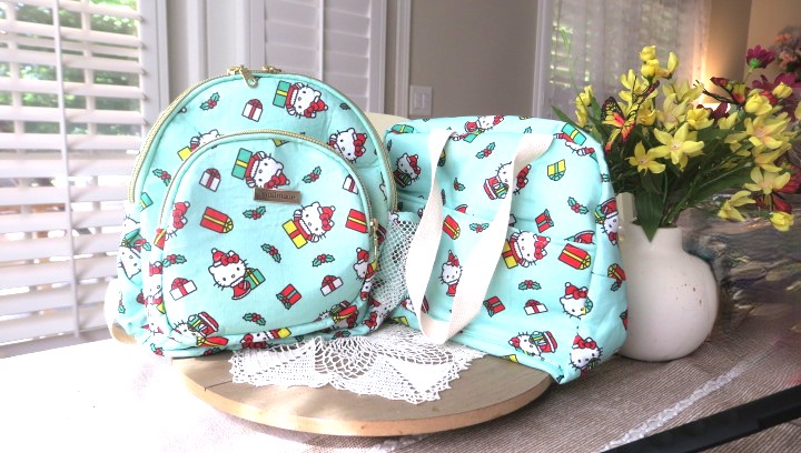 Handmade matching backpack and shoulder bag set in coordinating fabric displayed together on a table.