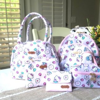 Handmade matching bag set featuring coordinated floral backpack, shoulder bag, lunch bag, cosmetic pouch, and small accessory purse.