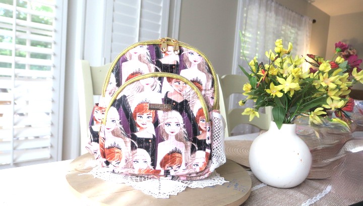 Handmade floral mini backpack featuring quilted fabric, boutique-style craftsmanship, and practical everyday storage.