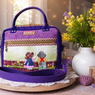 Handmade Japanese woven appliqué handbag featuring a countryside scene and purple fabric accents.