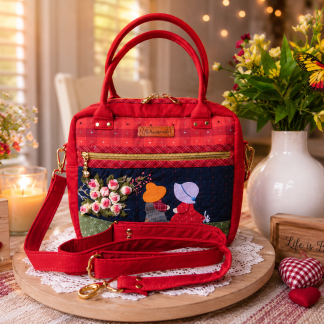 Handmade floral friendship appliqué handbag crafted from Japanese woven fabric featuring two friends and blooming flowers.