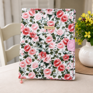 Handmade floral iPad and notebook cover with pink rose pattern and soft padded handmade design.