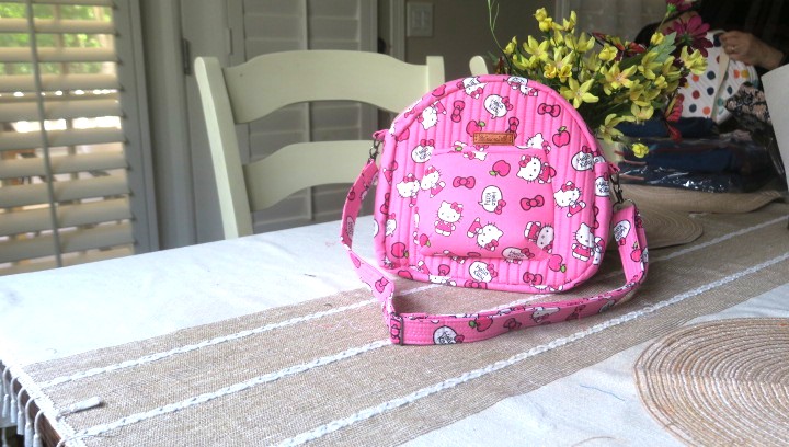 Handmade colorful bright pink shoulder bag with adjustable strap and quilted cotton design”