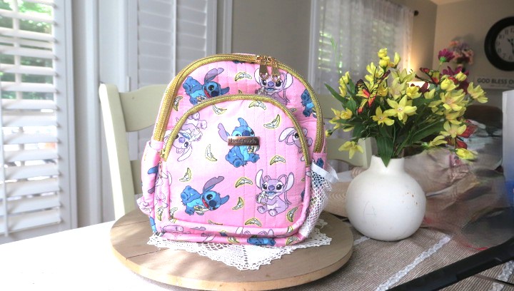 Handmade floral mini backpack featuring elegant patterns, quilted stitching, and boutique-style craftsmanship.