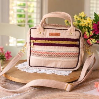 Handmade beige crossbody bag with embroidered front pocket and adjustable shoulder strap by Handmade Bags by Ladda.