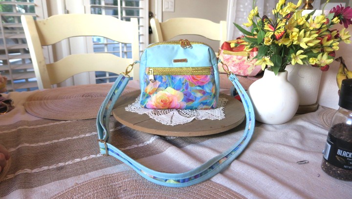 Handmade blue floral sling bag with colorful rose design