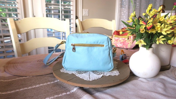Handmade blue floral sling bag with colorful rose design