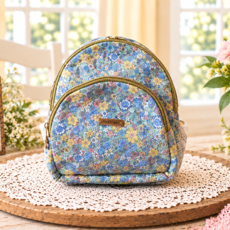 Handmade blue floral backpack purse with gold-tone zippers and a front zippered compartment
